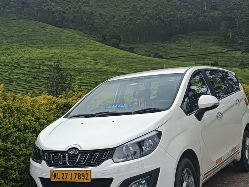 Cab with Munnar hills stunning view in background