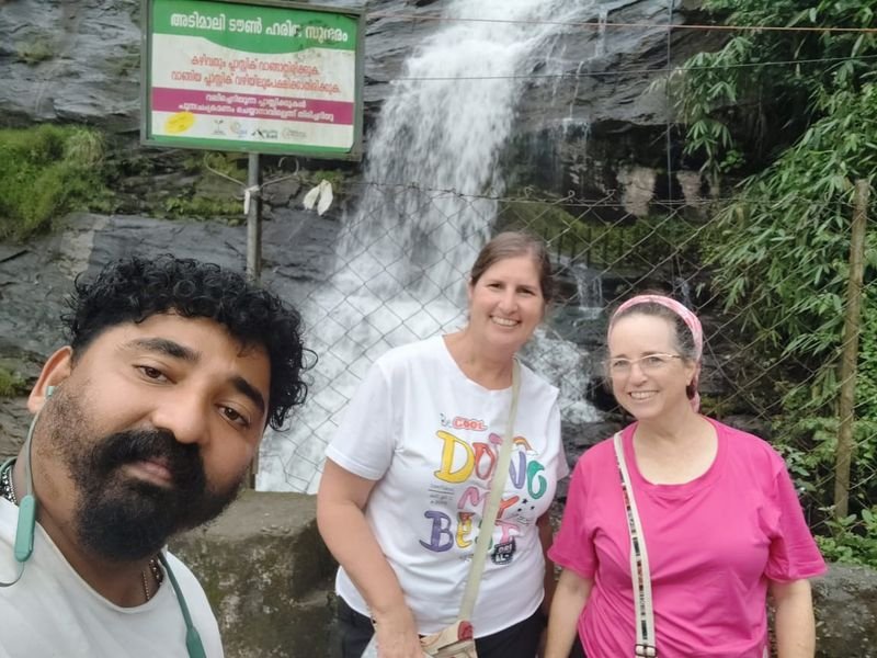Driver Antony with foreign guests at waterfalls