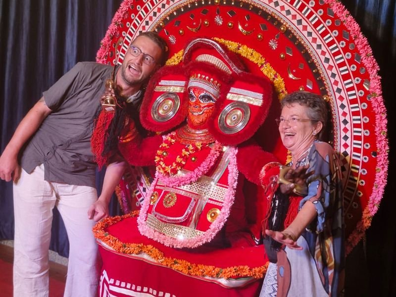 Foreign travelers with Theyyam Art Form
