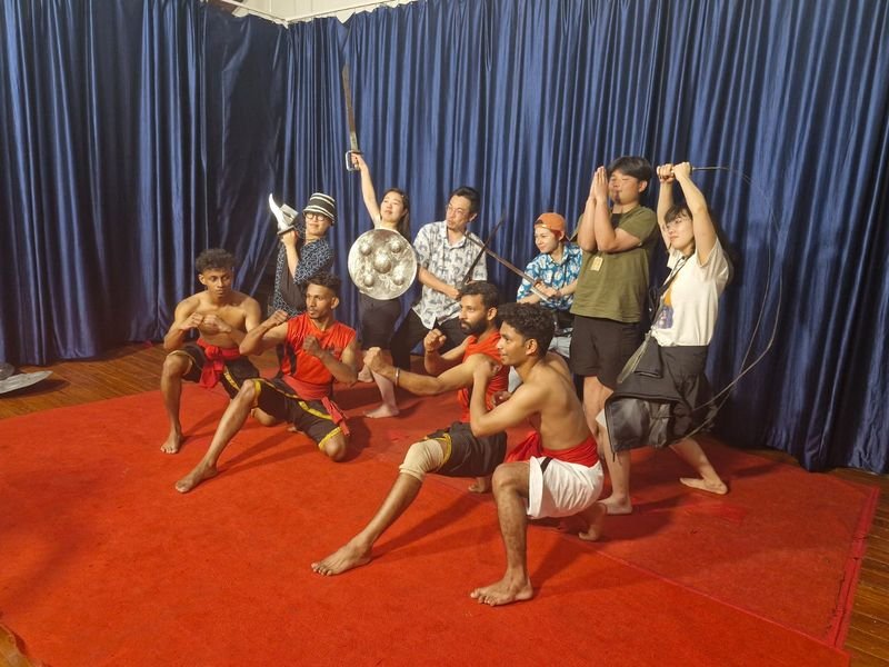 Foreigners posing with Kalarippayattu Team
