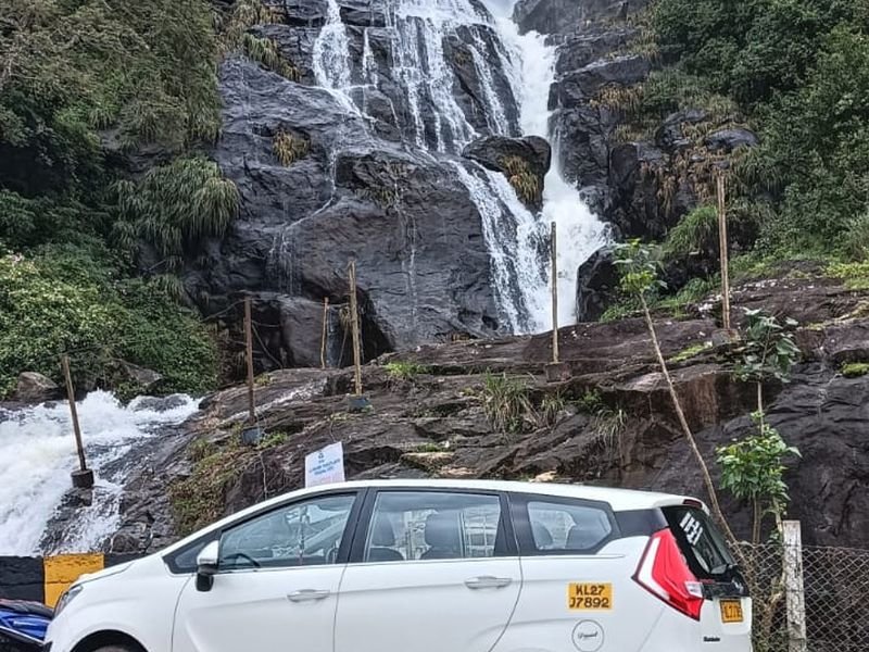 Stunning Car photo with waterfalls background