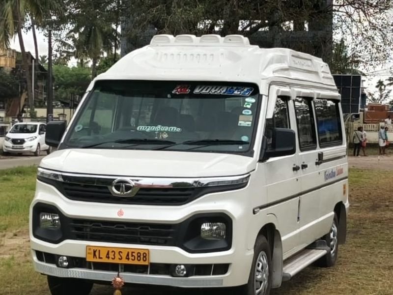 Tempo Traveller Stunning front side view in a greenery background