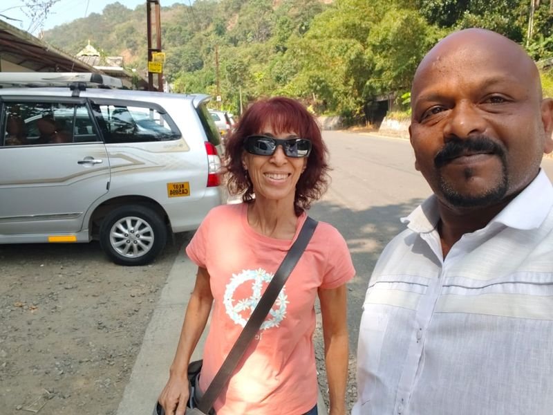 posing with traveller and cab