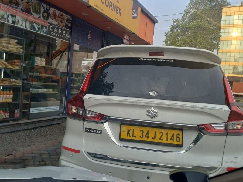 taxi back view parked near a bakery
